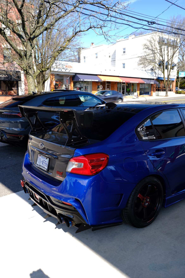 Domingo  E's 2017 WRX STI Limited Authentic Varis Rear Bumper, SideSkirts, Front Fenders, wing, and rear diffuser.
