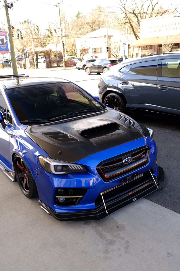 Domingo  E's 2017 WRX STI Limited Authentic Varis Rear Bumper, SideSkirts, Front Fenders, wing, and rear diffuser.