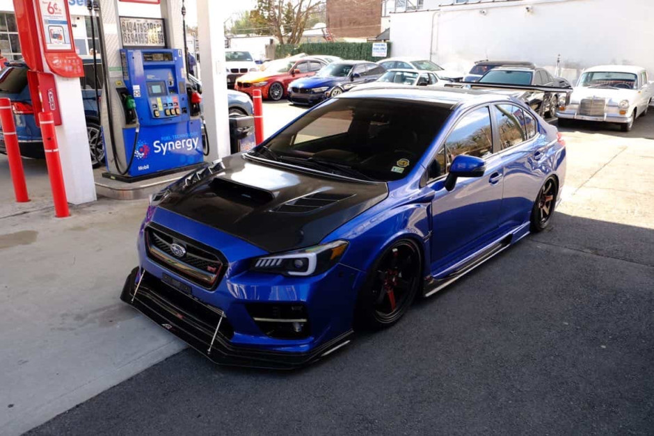 Domingo  E's 2017 WRX STI Limited Authentic Varis Rear Bumper, SideSkirts, Front Fenders, wing, and rear diffuser.
